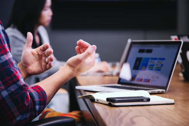 Business owner comparing US business loan options online